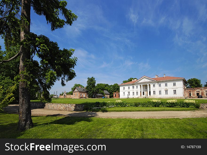 Palace during the repair with the garden into a sunny day. Palace during the repair with the garden into a sunny day