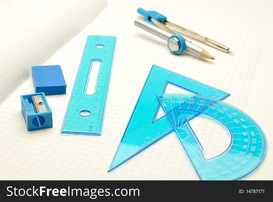 Rulers, compasses, eraser with sharpener for notebooks