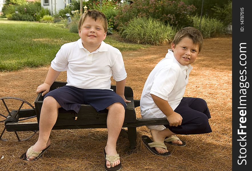 Two brothers hanging out together outdoors. Two brothers hanging out together outdoors.