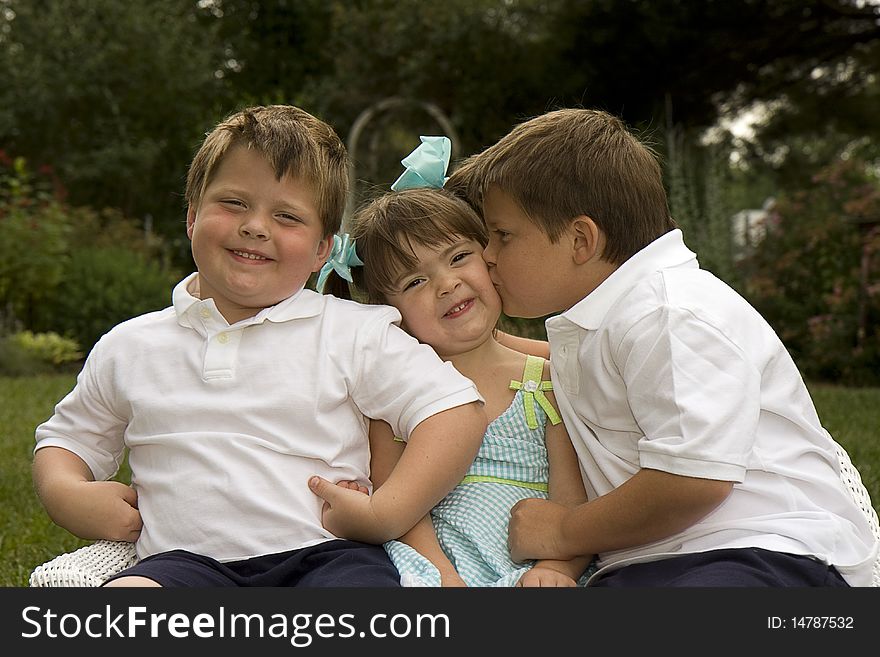 Brothers and sister enjoying each other's company. Brothers and sister enjoying each other's company