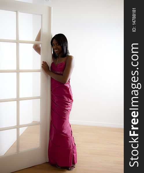 Pretty African American teen wearing formal prom dress. Pretty African American teen wearing formal prom dress.