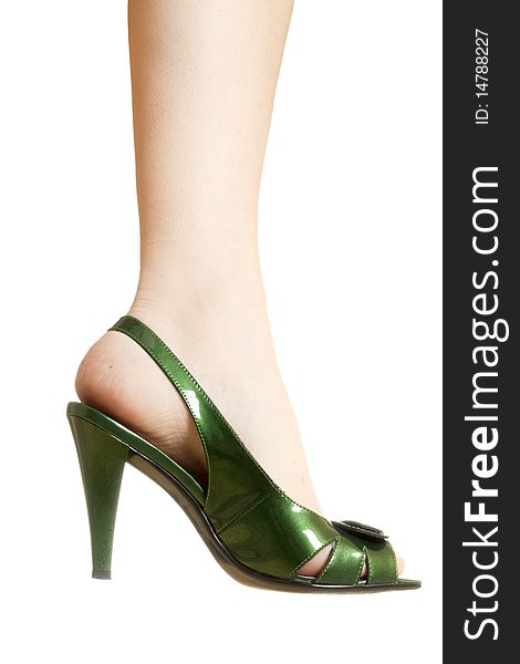 Sexy green leather high heels stilettos shoes and womens legs isolated on white background