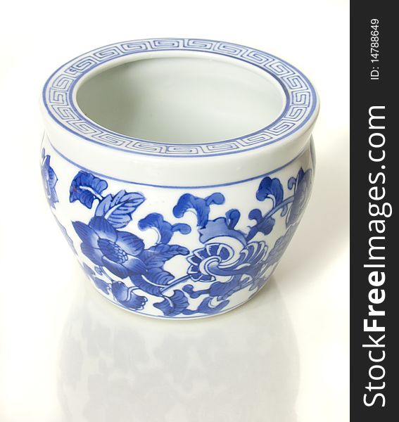 A traditional ceramic Chinese vase painted with flowers. A traditional ceramic Chinese vase painted with flowers
