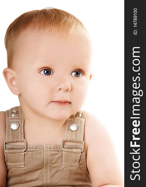 Little pretty smiling baby-boy with grey eyes, isolated on white background