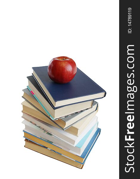 Stack of books with red apple isolated on the white background