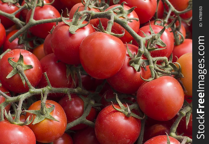 Organically grown red cherry tomatoes background