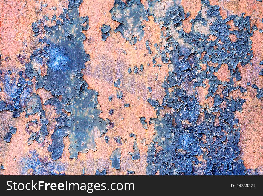 The old metal plate covered with paint and rust-eaten. The old metal plate covered with paint and rust-eaten