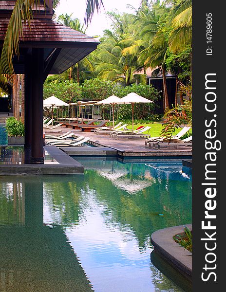 Swimming pool area at tropical vacation resort