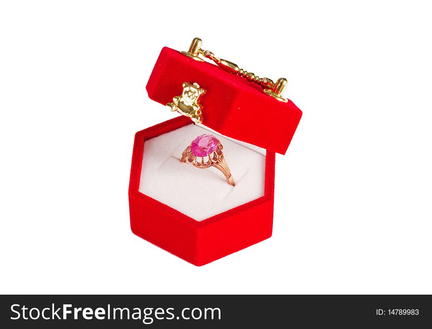 Red velvet box with golden ring