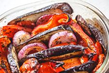 Baked Vegetables Tomatoes, Eggplants, Blue Onions, Zucchini, Zucchini In Glass Form On A Bright White Background. The Concept Of Stock Image Baked Vegetables Tomatoes, Eggplants, Blue Onions, Zucchini, Zucchini In Glass Form On A Bright White Background. The Concept Of Stock Image