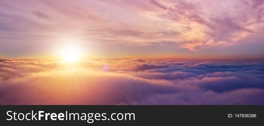 Beautiful sunset cloudy sky from aerial view. Airplane view above clouds. Beautiful sunset cloudy sky from aerial view. Airplane view above clouds