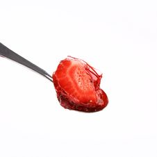 Strawberries Covered With Jelly On A Spoon Royalty Free Stock Image