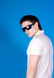 Brave Guy In The Studio Against A Blue Background Stock Photo Brave Guy In The Studio Against A Blue Background Stock Photo