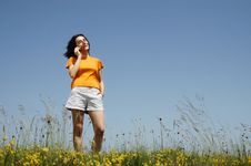 Happy Woman Enjoying The Outdoors Using Her Cell P Stock Photos