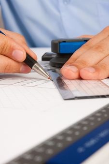 Architect Working On Architectural Plans Stock Photo