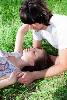 Boy And Beautiful Girl On Grass Royalty Free Stock Image