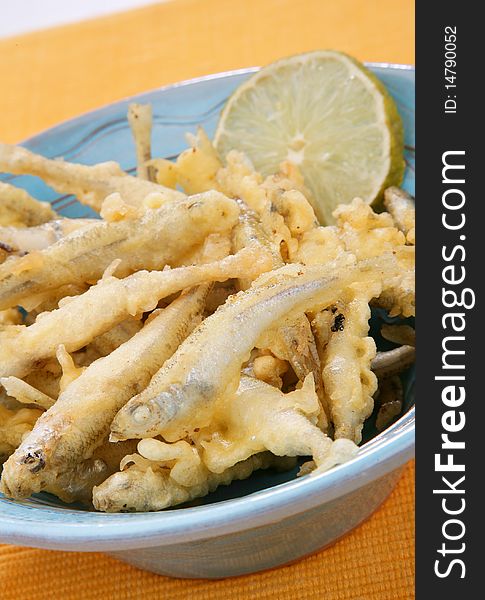 Delicious fresh fried fish on plate with lemon. Delicious fresh fried fish on plate with lemon