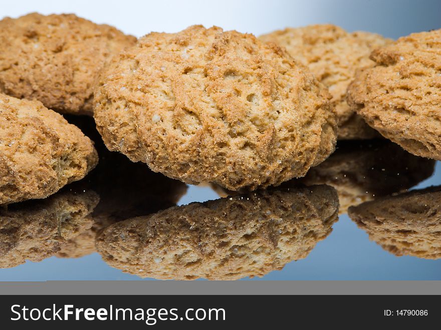 Oaten cookies on reflective surface