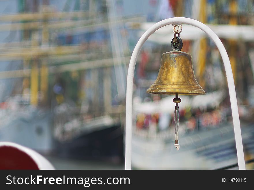 Ship's bell front sail ships with long mast. Ship's bell front sail ships with long mast