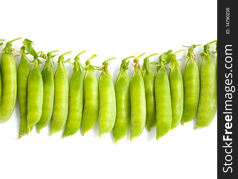 Green peas pods on a white background