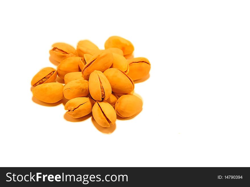 yellow pistachio nuts isolated on white