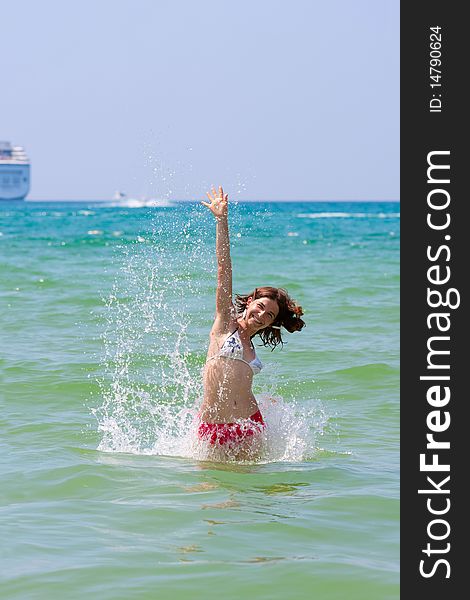 Girl with long hair playing in the sea. Girl with long hair playing in the sea