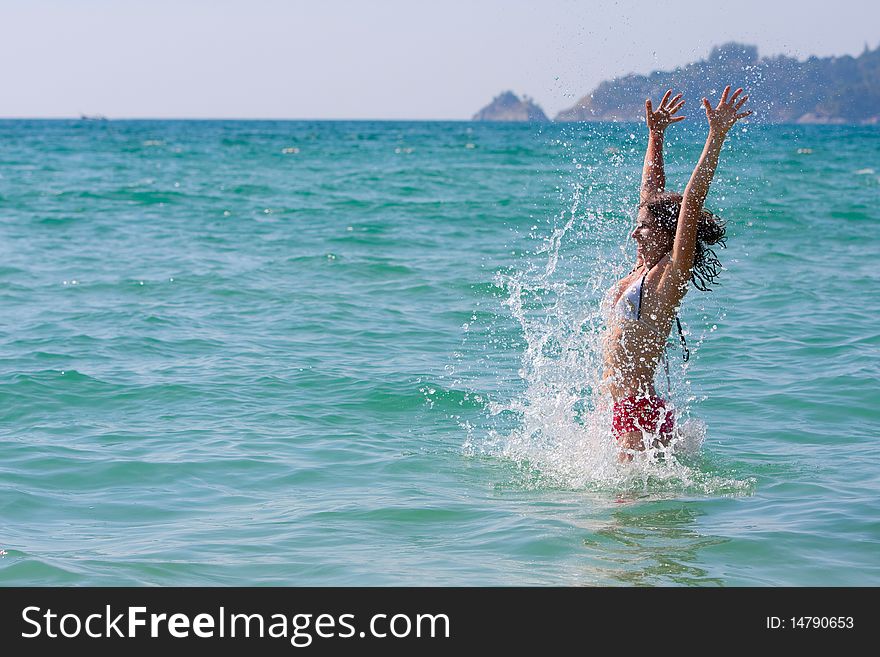 Girl with long hair playing in the sea. Girl with long hair playing in the sea