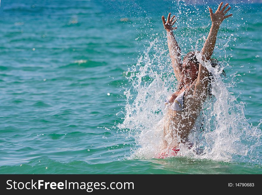 Girl with long hair playing in the sea. Girl with long hair playing in the sea