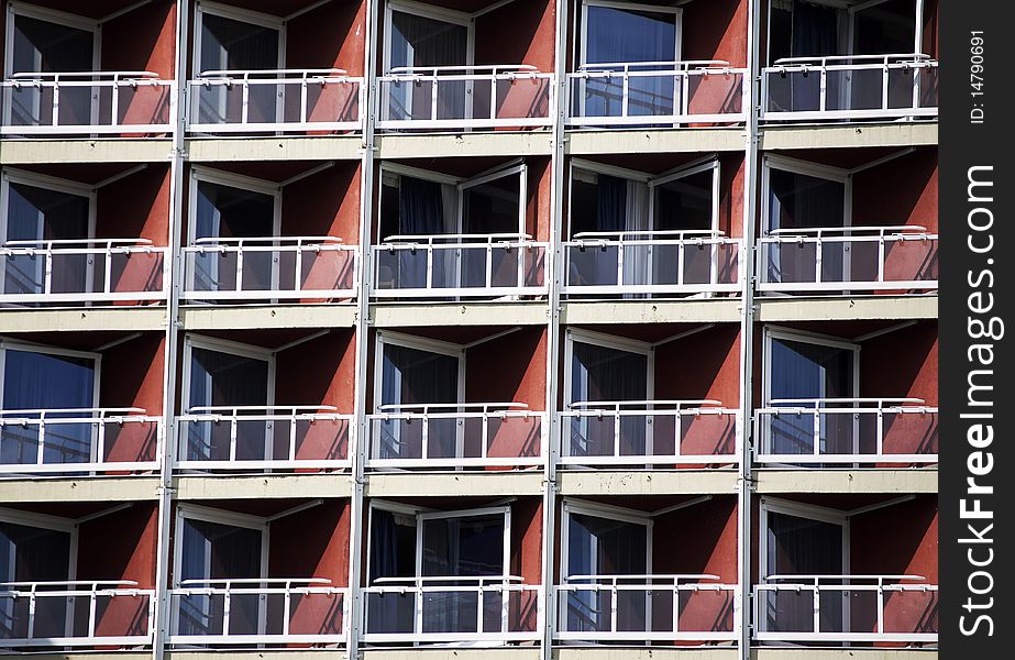 Hotel balconies in sunrise at the sea