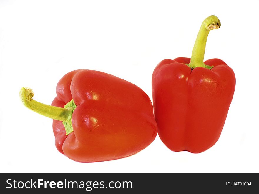 Two fresh and crunchy red bell peppers on a white background. Two fresh and crunchy red bell peppers on a white background