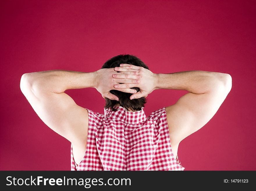 Muscular strong man isolated over red. Muscular strong man isolated over red