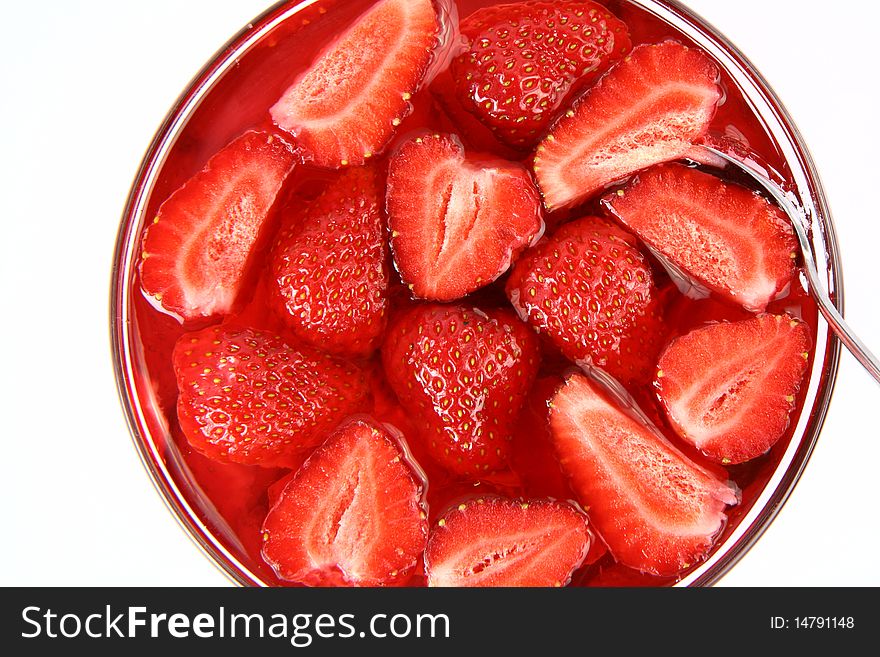 Jelly with strawberries and a spoon