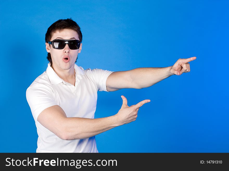 Surprised a guy with glasses on a blue background. Surprised a guy with glasses on a blue background