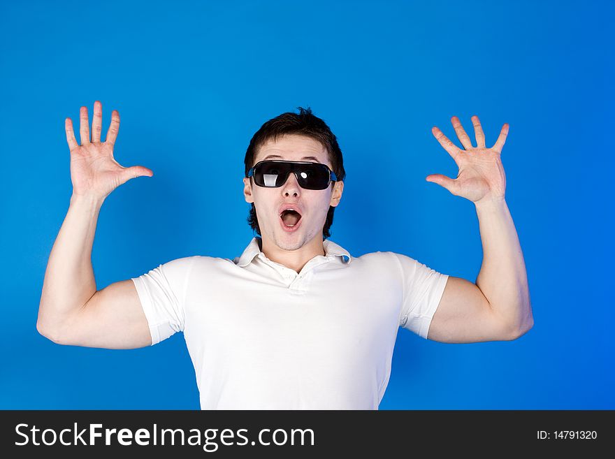 Brave guy in the studio against a blue background. Brave guy in the studio against a blue background