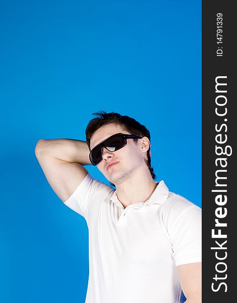 Brave guy in the studio against a blue background. Brave guy in the studio against a blue background