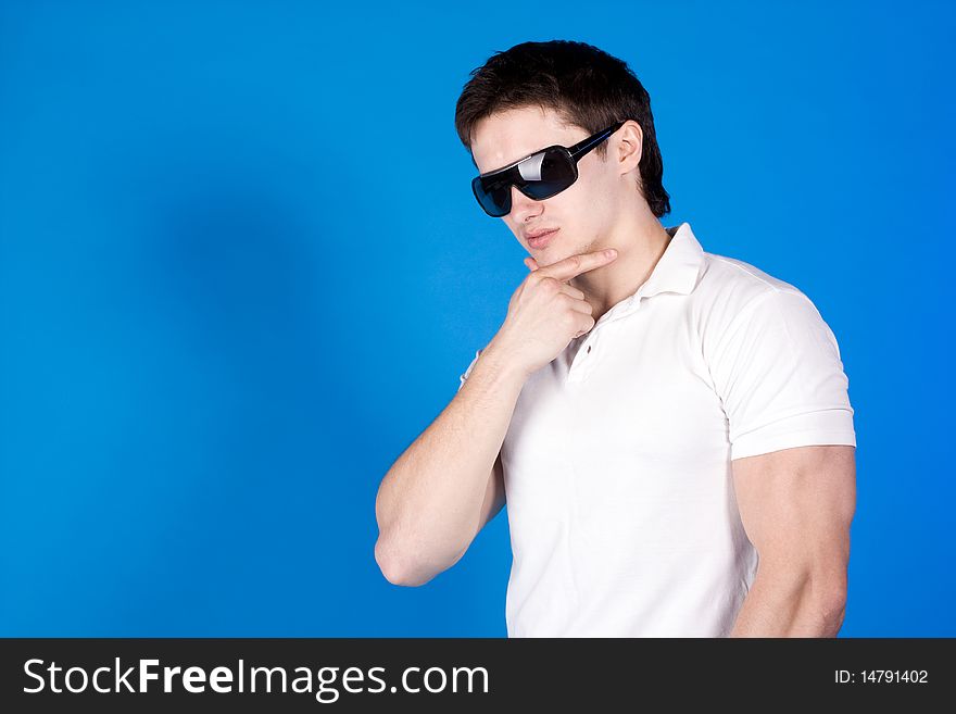 Confident Guy With The Glasses In The Studio