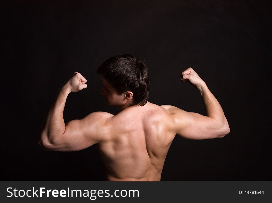 Back Of Sexy Muscular Man, Isolated On Black