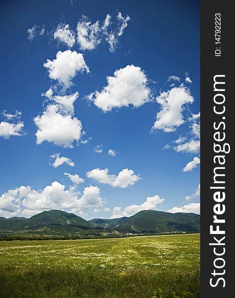 Summer landscape with blue sky, clouds and green color nature