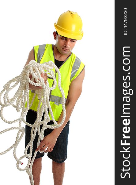 Builder, tradesman or construction worker at work gathering rope.  White background. Builder, tradesman or construction worker at work gathering rope.  White background.