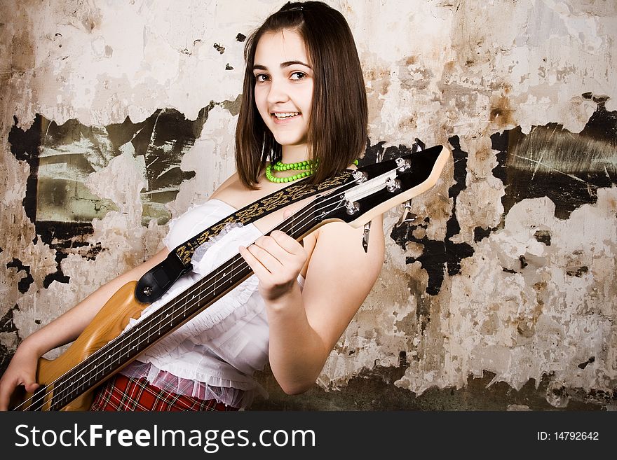 Young beauty music girl with guitar