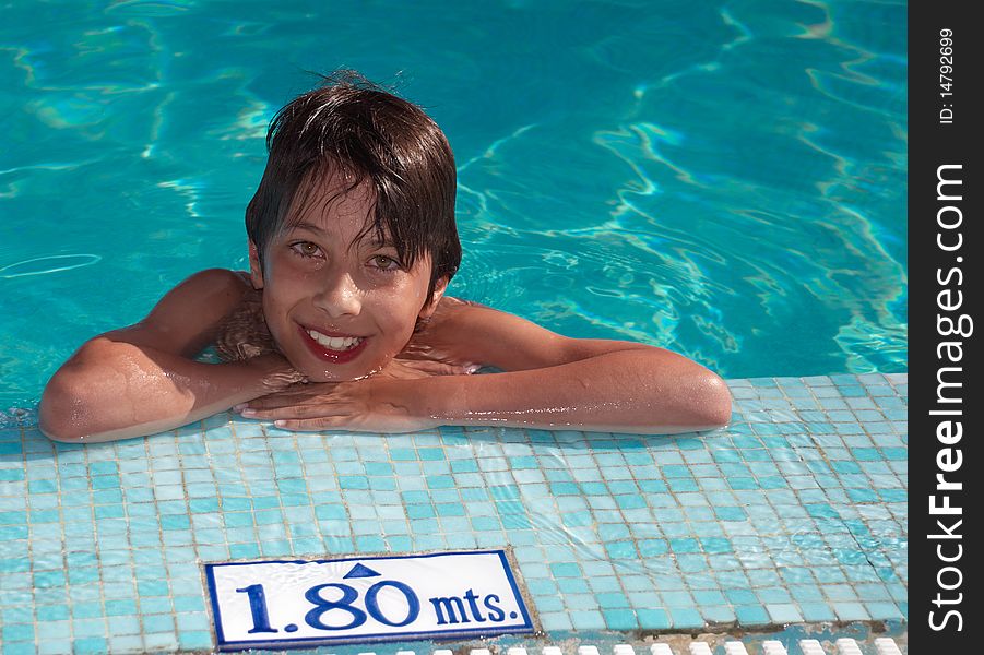 Young smiling boy in the swimming pool. Young smiling boy in the swimming pool
