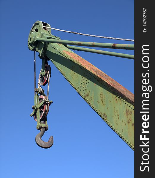 Crane in a dockyard against blue sky. Crane in a dockyard against blue sky