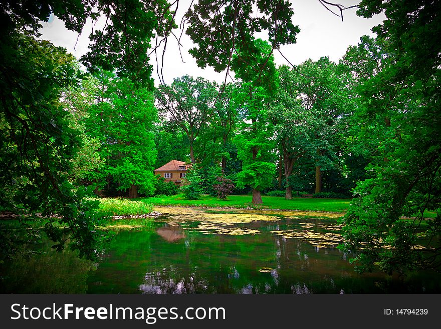 Cottage hidden in the park in spring time. Cottage hidden in the park in spring time