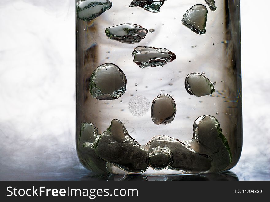 Glassware with bubbles of gas in liquid