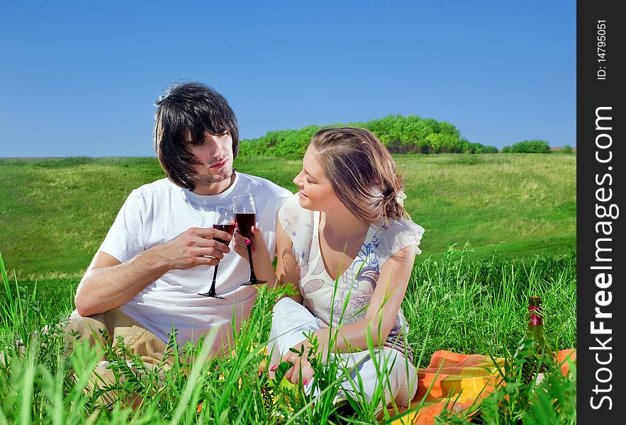 Boy and beautiful girl with wineglasses