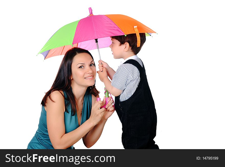 Mom and her young son together under an umbrella. On a white background.