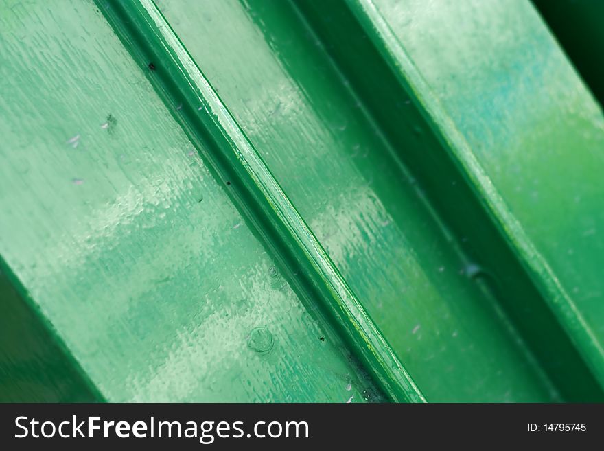 Detail of a bright green gloss painted surface. Detail of a bright green gloss painted surface