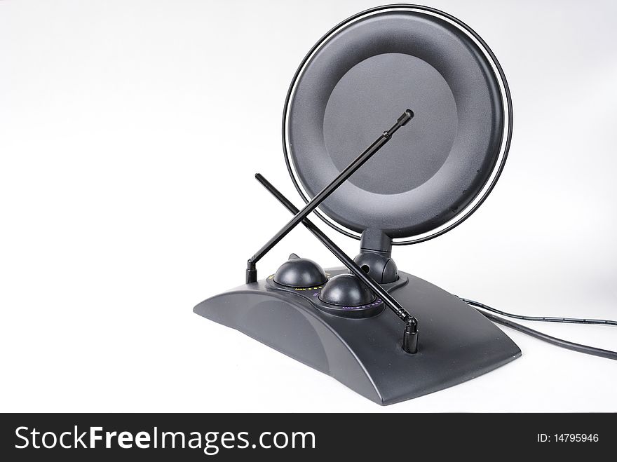 A television antenna with dish on white background. A television antenna with dish on white background.