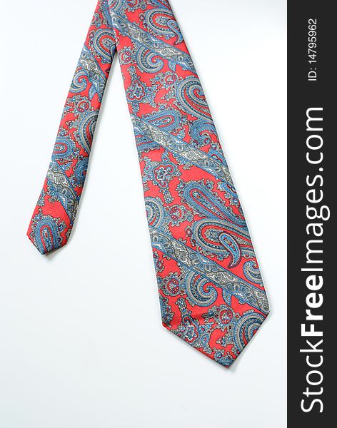 A tie with a paisely design on white. A tie with a paisely design on white.