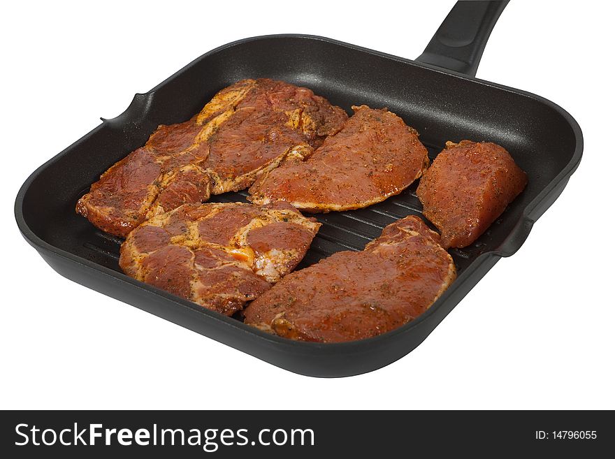 Frying pan with meat to the barbecue, isolated with clipping path before white background